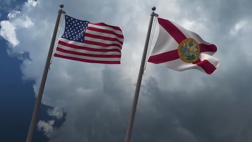 Waving American and Florida Flags with Cloudy Sky Background