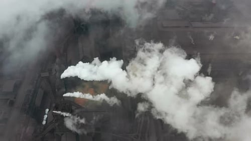 Industrial Complex Emitting Plumes of Smoke, Aerial View