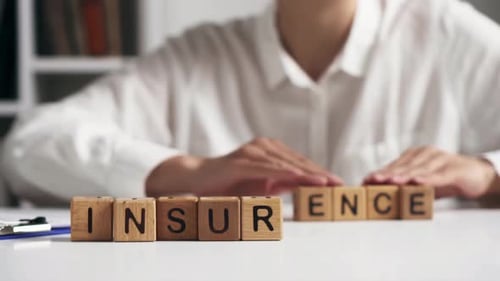 Wooden Blocks Spelling Insurance in Corporate Setting