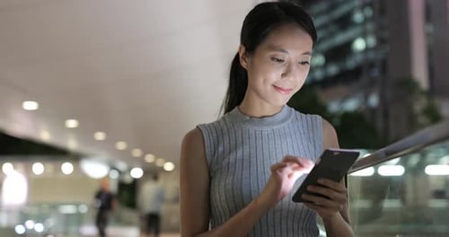Business Woman Use of Mobile Phone in City
