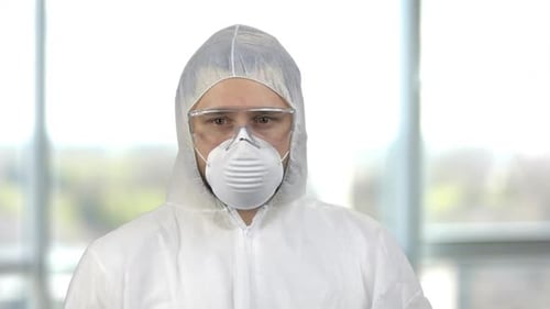 Man in Protective Suit Wearing Mask and Glasses