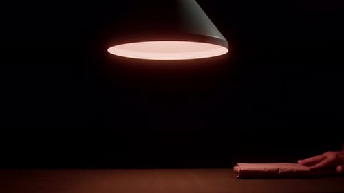 Package being passed between two people close up