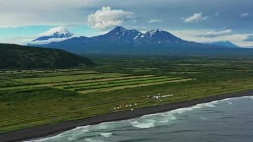 Beach with Black Sand and Volcano