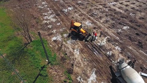 Excavator working on field. Industrial excavator during construction works