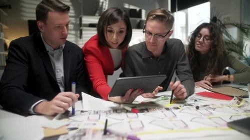 In Creative Office Productive Coworkers Standing at the Table, Company Meeting. Business People