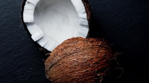 Split Into Two Halves Coconut on a Black Background