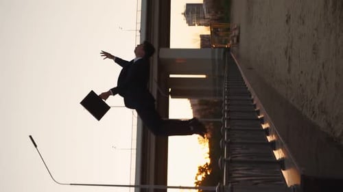 Successful Businessman with Business Briefcase is Doing Back Somersault