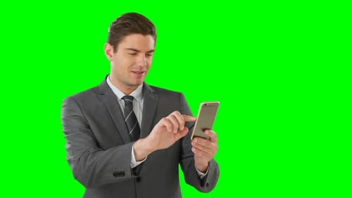Man in Suit Using Phone on Green Screen