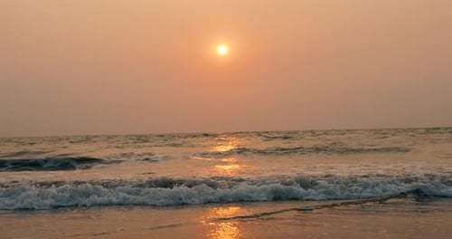 Amazing Beach Sunset with Endless Horizon and Lonely Figures in the Distance and Incredible Foamy