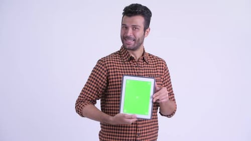 Young Adult Presenting Tablet with Green Screen