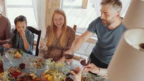 Family Celebrates Together at Festive Dinner Table