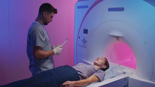 Woman Getting into Tube for MRI
