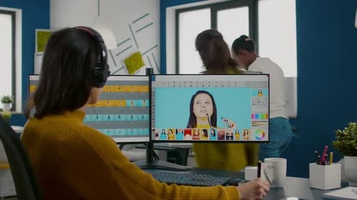 Female Retoucher Editing Photos in Creative Media Agency Office