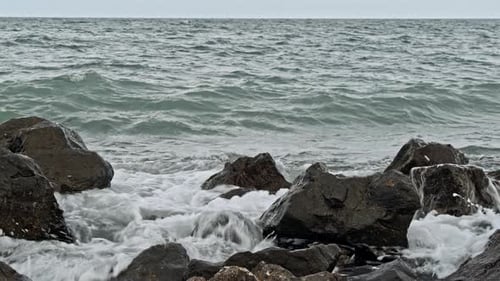 Powerful Waves on a Rocky Beach