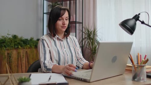 Young Woman Freelancer Wearing Headset Call Center or Support Service Operator Helpline Having Talk