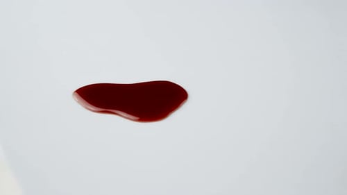 Paper Towel Cleans Dark Red Liquid Spill