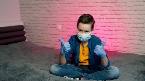 Young Subject Wearing Protective Gear Making Hand Gestures