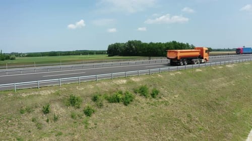 Trucks Driving on Highway in Rural Area