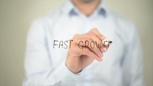 Hand Writes "Fast Growth" Concept
