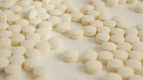 Pile of Beige Pills Close Up