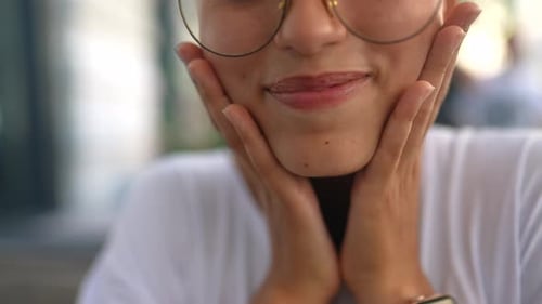 Adult Smiles with Hands to Face Close Up