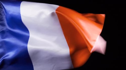 French Flag Waving Against Black Background