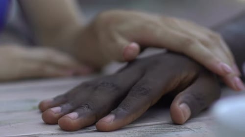 Hands Touching in a Display of Love