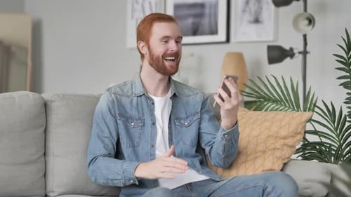 Man on Video Call in Cozy Living Room