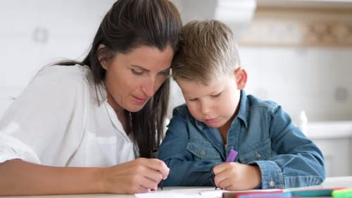 Mother and Child Drawing Together at Home
