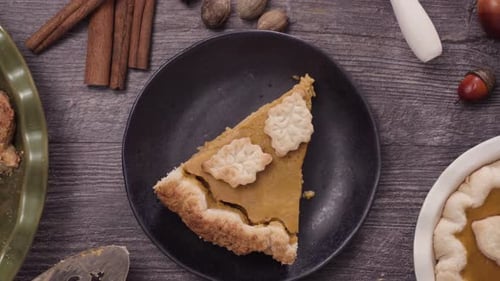 Slice of Pumpkin Pie with Cinnamon and Acorns