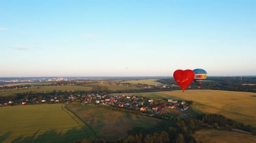 Hot Air Balloon in the Sky Over a Field