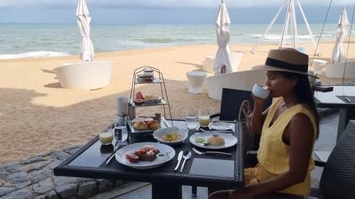 Breakfast on the Beach in Thailand a Luxury Breakfast Table with Food and Beautiful Tropical Sea