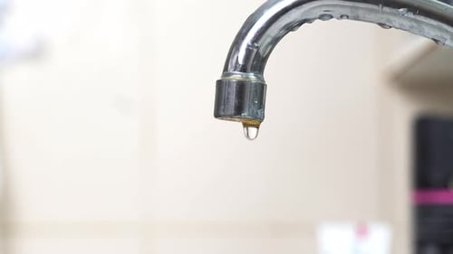 Leaky Chrome Faucet Dripping Water Close Up