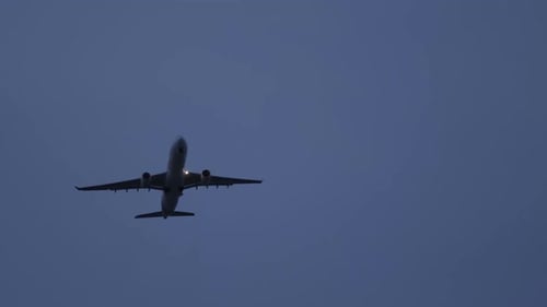 Commercial Airplane Flying at Night