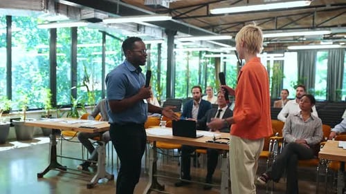 Business Presentation with Audience in Bright Office Space