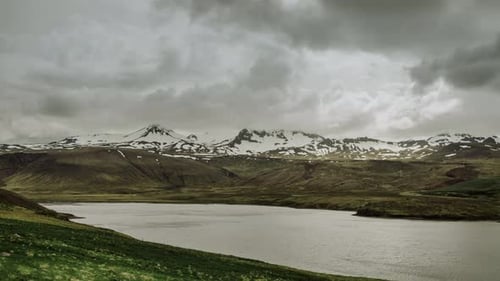 Rolling Clouds Over Nothern Snow Mountains With Glacer And Arctic Sea Harbour In Iceland