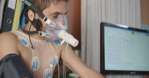 Man going through a cardio-vascular test in a hospital