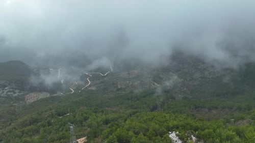 Foggy road in the mountains aerial view 4 K