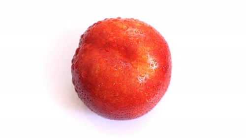 Fresh Nectarine with Water Droplets on White Background