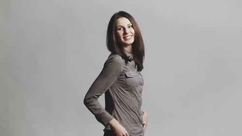 Woman Posing Elegantly in Studio Setting