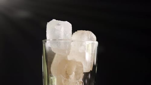 A showcase of the rotation cola with ice close up for a very large glass of cold with slow motion ro