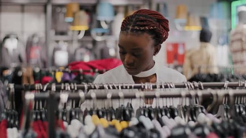 Closeup African American Serious Girl Seller Saleswoman Female Buyer Woman Consumer Clothing Store