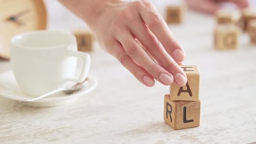 Stacking Cubes Spelling Goal on Desk