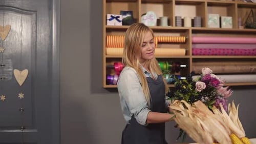 Blonde Woman Arranging Beautiful Flower Bouquet