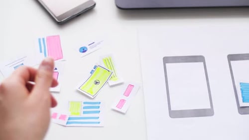 Hands Designing Mobile App User Interface Mockup