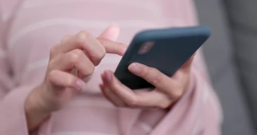 Hands Using Smartphone in Home Setting Close Up