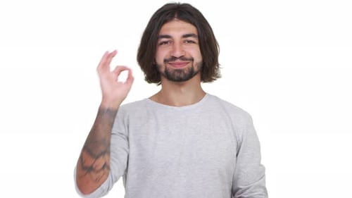 Man Smiling and Giving OK Hand Gesture