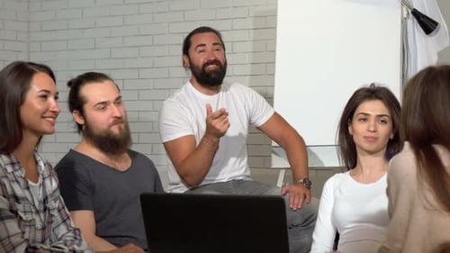Business Team Applauding During Meeting at the Office