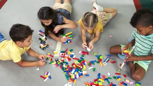 Preschool Kids Playing with Toys on the Floor
