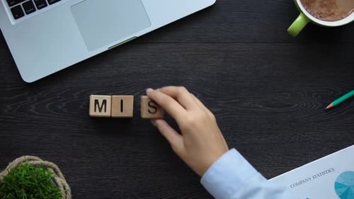 Spelling Mission with Wooden Blocks on Desk